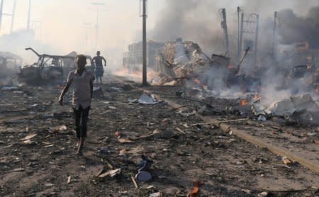 Civilians evacuate from the scene an explosion in KM4 street in the Hodan district in Mogadishu, Somalia October 14, 2017. Picture taken October 14, 2017. REUTERS/Feisal Omar