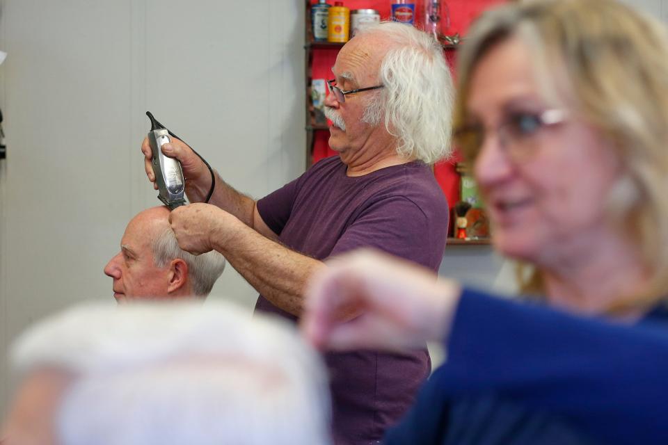 Manny Medeiros and fellow barber Janice Parker are set to retire after forty years cutting hair at Not Your Father's Moustache in downtown New Bedford.