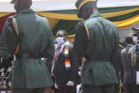 Zimbabwe President Emmerson Mnangagwa attends the burial of Dr Ellen Gwaradzimba who died of COVID-19, at the Heroes Acre in Harare, Thursday, Jan. 21, 2021. Zimbabwean President Emmerson Mnangagwa who presided over the burial called the pandemic "evil" and urged people to wear masks, practice social distancing and sanitize, as cases across the country increased amid a fragile health system. (AP Photo/Tsvangirayi Mukwazhi)