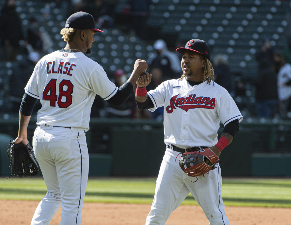 Cleveland Indians' Jose Ramirez, left congratulates closer Emmanuel Clase after a baseball game against the New York Yankees in Cleveland, Sunday, April 25, 2021. Cleveland won 7-3. (AP Photo/Phil Long)