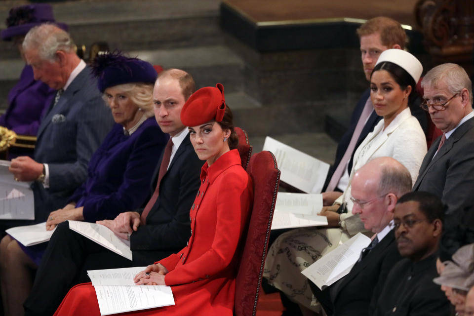FILE - In this Monday, March 11, 2019 file photo, Britain's Kate, Duchess of Cambridge, foreground centre, sits with Prince William, Camilla, the Duchess of Cornwall and Prince Charles, front row, Prince Andrew, background right, Meghan, the Duchess of Sussex and Prince Harry, at the Commonwealth Service at Westminster Abbey in London. King Charles III will hope to keep a lid on those tensions when his royally blended family joins as many as 2,800 guests for the new king’s coronation on May 6 at Westminster Abbey. All except Meghan, the Duchess of Sussex, who won’t be attending. (AP Photo/Kirsty Wigglesworth, Pool, File)