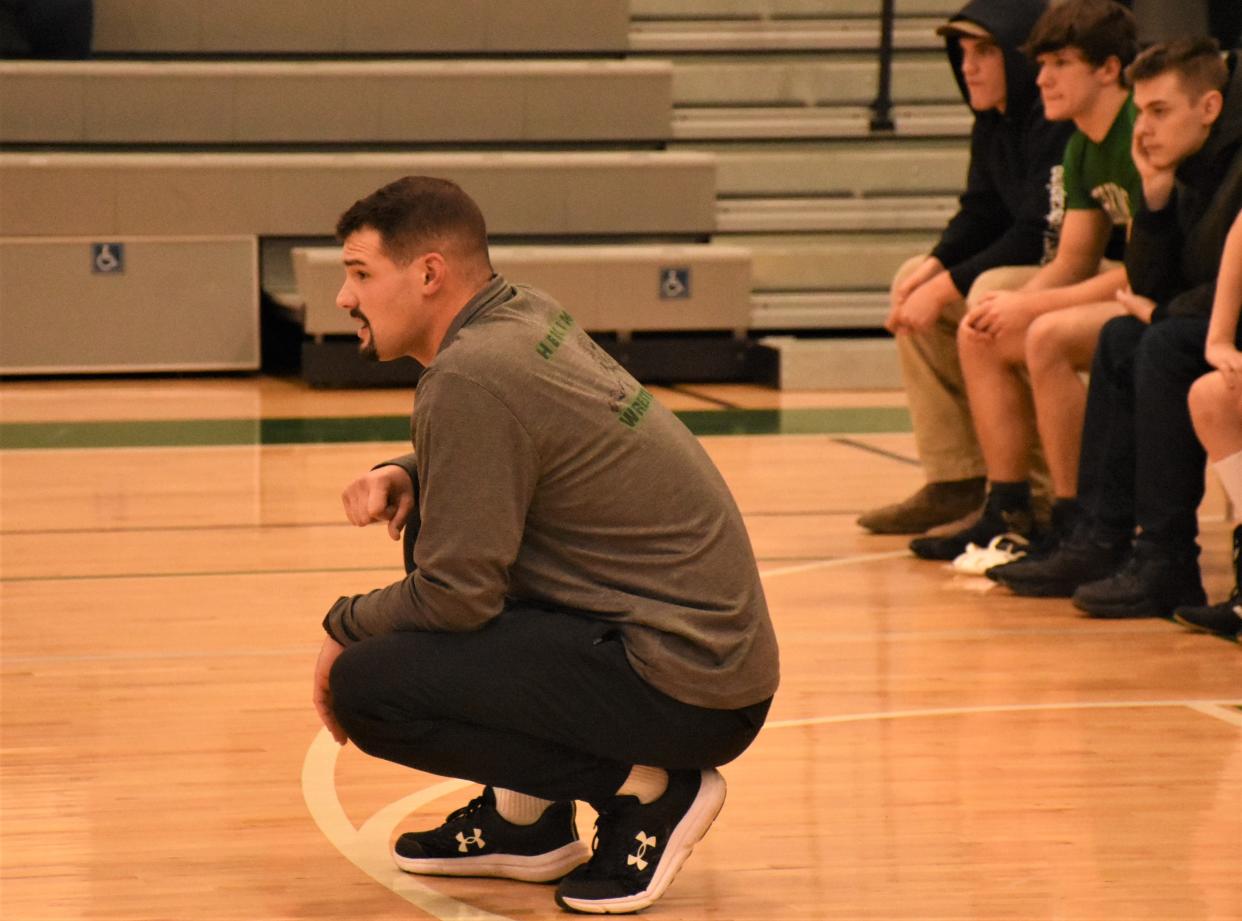 Herkimer coach Dan Appley watches the Magiacians on the mat against Mt. Markham Tuesday. Appley won mor than 100 matches while in school at Herkimer and finished his scholastic career as a state finalist in 2015; Herkimer dropped the sport the year after he graduated and brought it back this year.