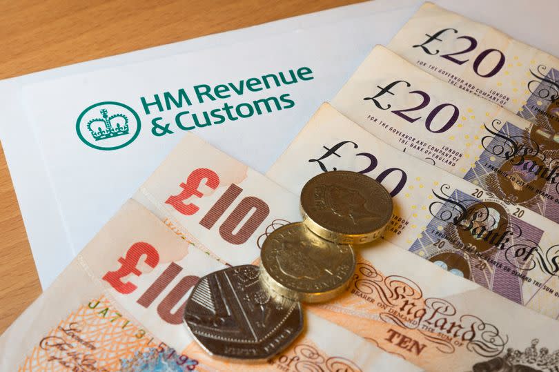 HMRC (Her Majesty's Revenue and Customs) letter head surrounded by British bank notes and coins.