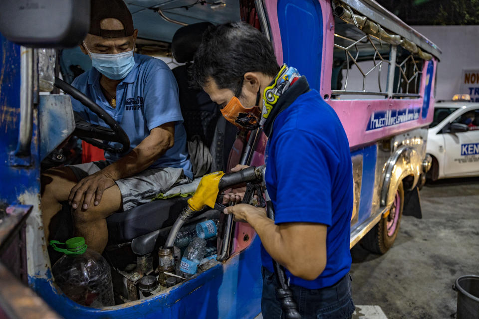 MANILA, PHILIPPINES - MARCH 07: A worker loads diesel on a jeepney at a gas station, a day before a huge price increase on petroleum products is implemented, on March 07, 2022 in Quezon City, Metro Manila, Philippines. Shares in Asian markets declined on Monday amid fears of an inflation shock in the world economy already reeling from pandemic-era snarls as the ongoing Russia-Ukraine war continues to send oil prices soaring. (Photo by Ezra Acayan/Getty Images)