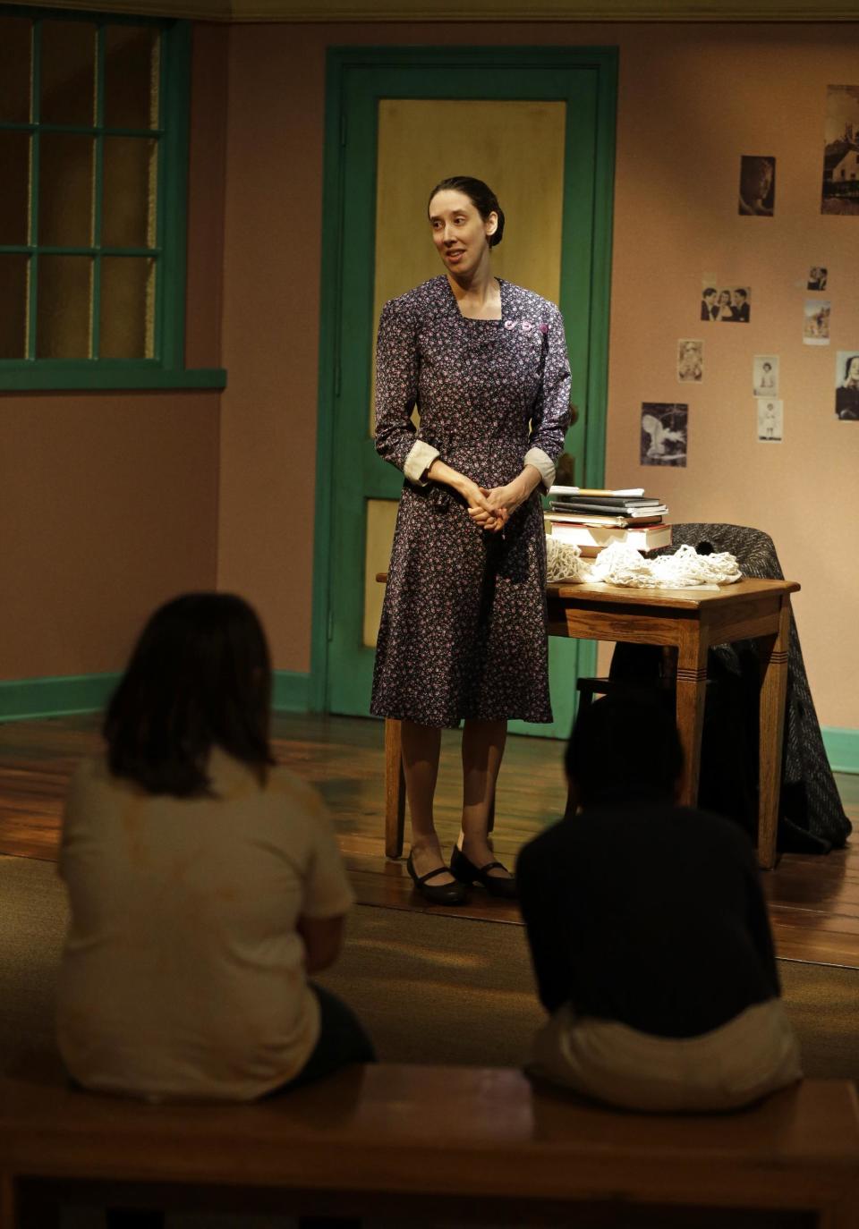 In this Monday, March 18, 2013 photo, actress Julie Mauro portrays Miep Gies, one of Anne Frank’s protectors and the woman who preserved her diary, during a performance in an Anne Frank exhibition at the Indianapolis Children's Museum in Indianapolis. Eleven saplings grown from seeds taken from the massive chestnut tree that stood outside the home in which Frank and her family hid are being distributed to museums, schools, parks and Holocaust remembrance centers through a project led by The Anne Frank Center USA. (AP Photo/Michael Conroy) (AP Photo/Michael Conroy)