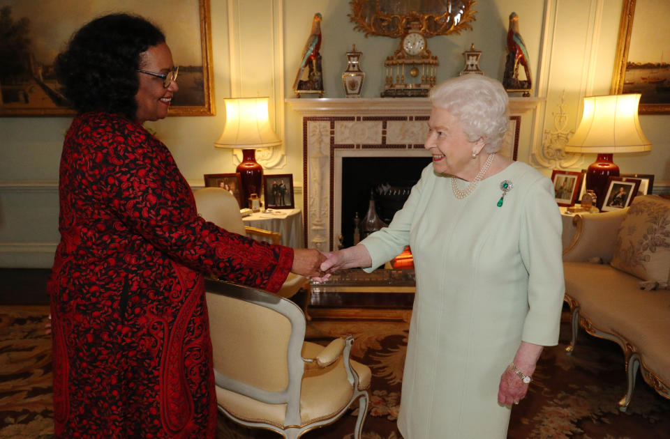 Britain's Queen Elizabeth II (R) presents Jamaican poet Lorna Goodison with the Queen's Gold Medal for Poetry during an audience at Buckingham Palace in central London on March 5, 2020. (Photo by Jonathan Brady / POOL / AFP) (Photo by JONATHAN BRADY/POOL/AFP via Getty Images)