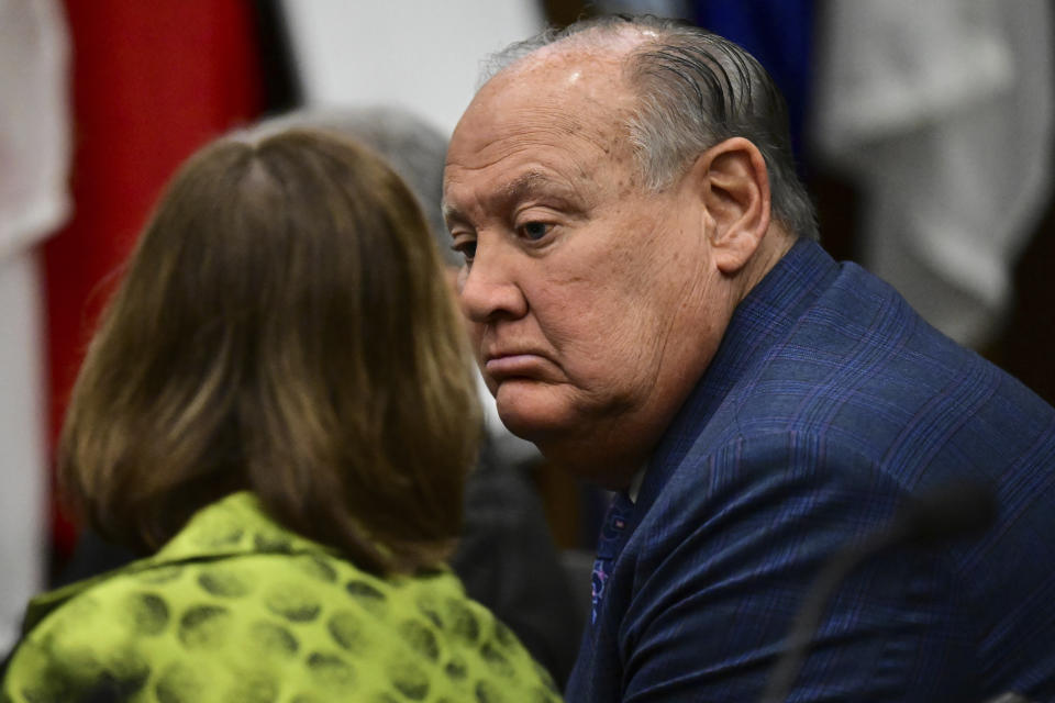 Former FirstEnergy CEO Charles Jones, right, listens to his attorney Carole Rendon inside the courtroom at the Summit County courthouse in Akron, Ohio, on Tuesday, Feb. 13, 2024. Two fired top executives of FirstEnergy Corp. and Ohio’s former top utility regulator have pleaded not guilty in connection with a $60 million bribery scheme. (AP Photo/David Dermer)