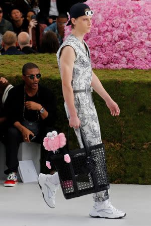 A model presents a creation by designer Kim Jones for Dior Homme collection as part of their Spring/Summer 2019 collection show during Men's Fashion Week in Paris, France, June 23, 2018. REUTERS/Pascal Rossignol