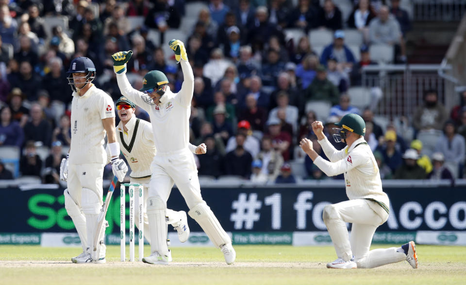 England's Joe Denly (left) appears dejected after being caught out by Australia's Marnus Labuschagne during day five of the fourth Ashes Test at Emirates Old Trafford, Manchester. (Photo by Martin Rickett/PA Images via Getty Images)