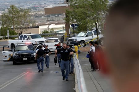 Police are seen after a mass shooting at a Walmart in El Paso