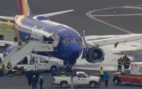 A Southwest Airlines flight made an emergency landing in Philadelphia after one of its engines blew out mid air - Credit: CNN