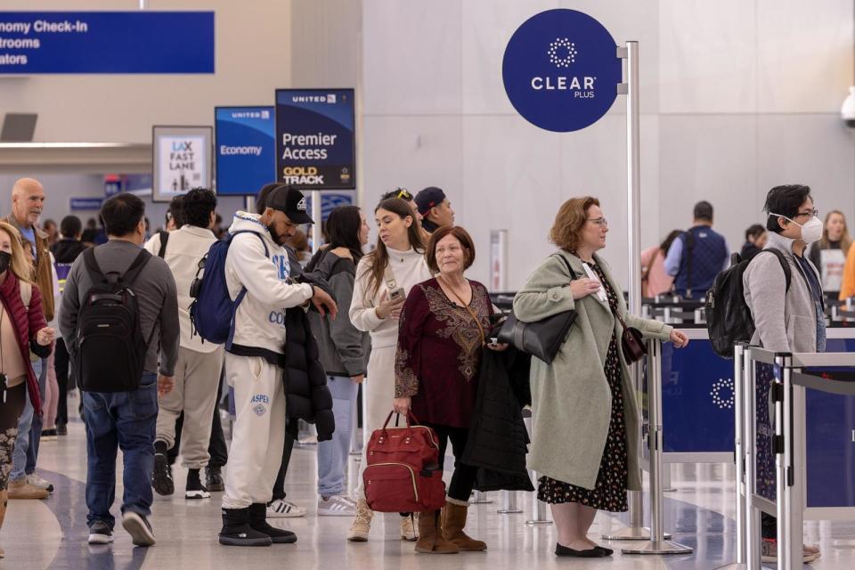 PHOTO: Passengers stand in Clear Plus line that gets them to their gate faster, using their eyes or fingerprints to verification, at Los Angeles International Airport, Jan. 10, 2024. (Irfan Khan/Los Angeles Times via Getty Images)