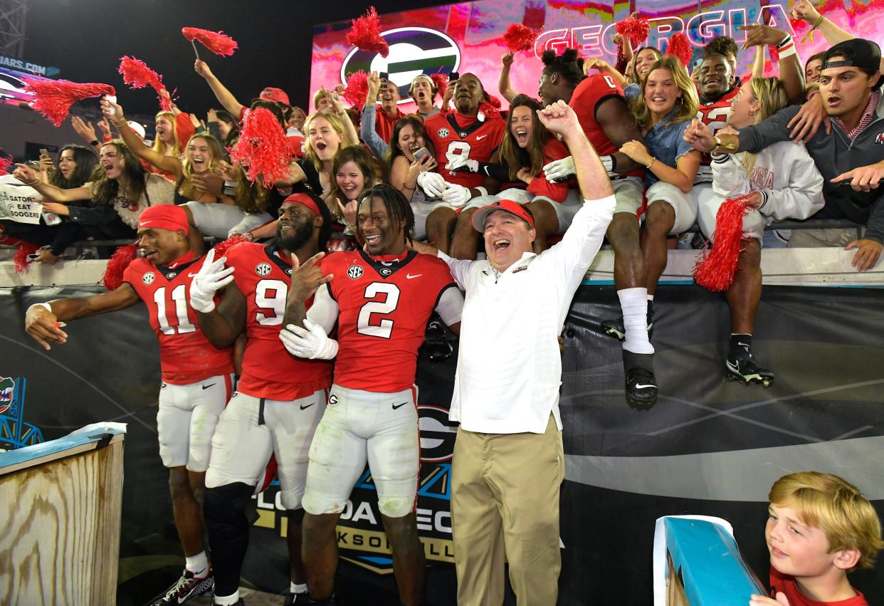 Georgia Bulldogs head coach Kirby Smart celebrates with his players and fans after their victory over Florida. The annual Georgia vs Florida football rivalry was held at TIAA Bank Field in Jacksonville, FL Saturday, October 29, 2022. The Bulldogs went in at halftime with a 28 to 3 lead over the Gators and won with a final score of 42 to 20. [Bob Self/Florida Times-Union]

Jki 102822 Bs Georgia Vs Florida Football Game 2nd Half 06