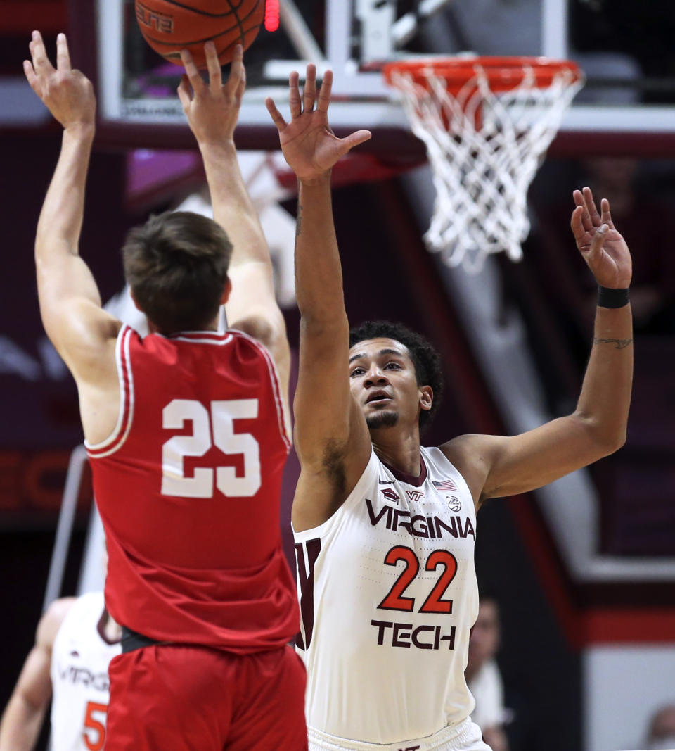 Cornell's Dean Noll (25) shoots over Virginia Tech's Keve Aluma (22) during the first half of an NCAA college basketball game Wednesday, Dec. 8 2021, in Blacksburg, Va. (Matt Gentry/The Roanoke Times via AP)