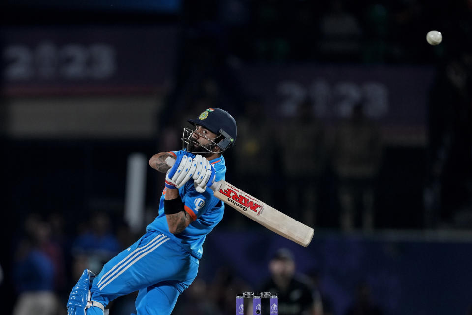 India's Virat Kohli plays a shot during the ICC Men's Cricket World Cup match between India and New Zealand in Dharamshala, India, Sunday, Oct. 22, 2023. (AP Photo/Manish Swarup)