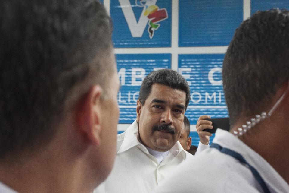 Venezuelan President Nicolas Maduro speaks to the press before entering the V Summit of the Community of Latin American and Caribbean States, in Bavaro, Dominican Republic, Wednesday, Jan. 25, 2017. (AP Photo/Tatiana Fernandez)