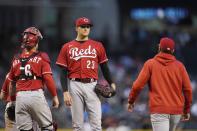 Cincinnati Reds manager David Bell, right, arrives on the mound to remove starting pitcher Jeff Hoffman (23) from the baseball game as Reds catcher Tucker Barnhart stands near the mound during the fifth inning against the Arizona Diamondbacks on Saturday, April 10, 2021, in Phoenix. (AP Photo/Ross D. Franklin)