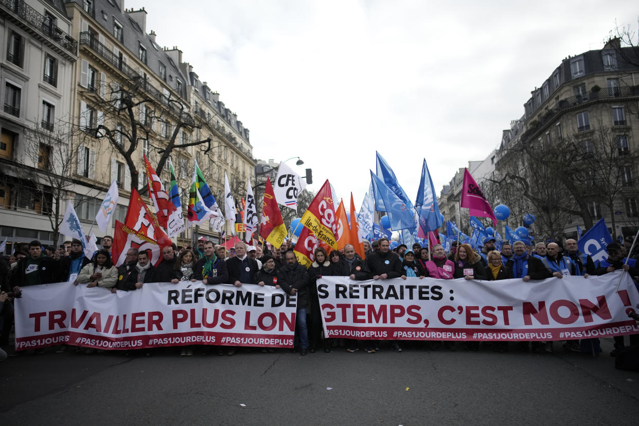 Union leaders lead a demonstration in Paris