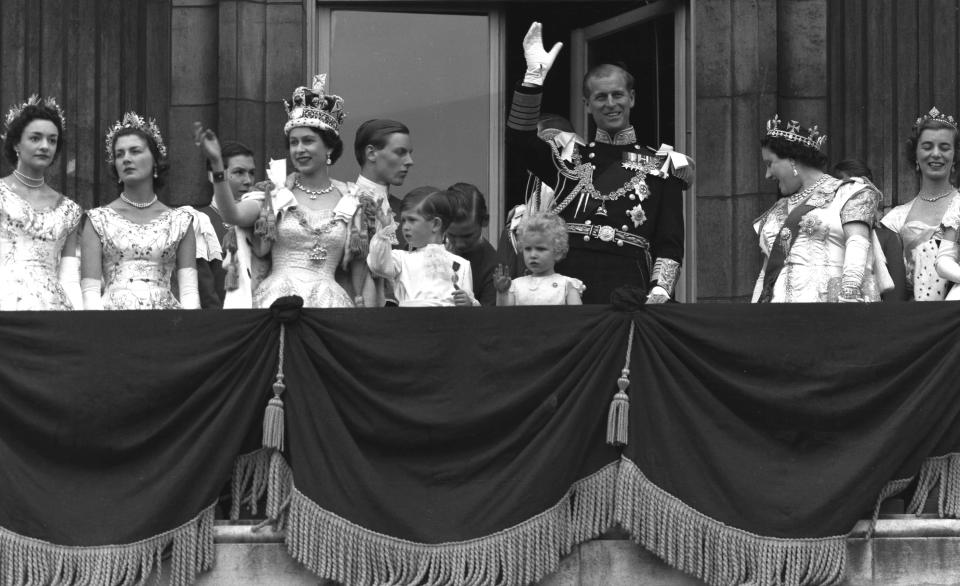 FILE - Britain's Queen Elizabeth II and Prince Philip, Duke of Edinburgh, gather with other members of the British Royal Family to greet supporters from the balcony at Buckingham Palace following her coronation, which took place in Westminster Abbey. London, June. 2, 1953. The Associated Press will muster a small army to cover King Charles III's coronation this weekend. For his mother's crowning 70 years ago, the wire service also enlisted the help of an air force. In 1953, it took eight minutes to transmit a single black-and-white photograph, provided the weather conditions and phone lines cooperated. So among the methods AP employed to deliver photos from London to its American newspaper clients was an arrangement to put them on Royal Air Force bombers. (AP Photo, file)