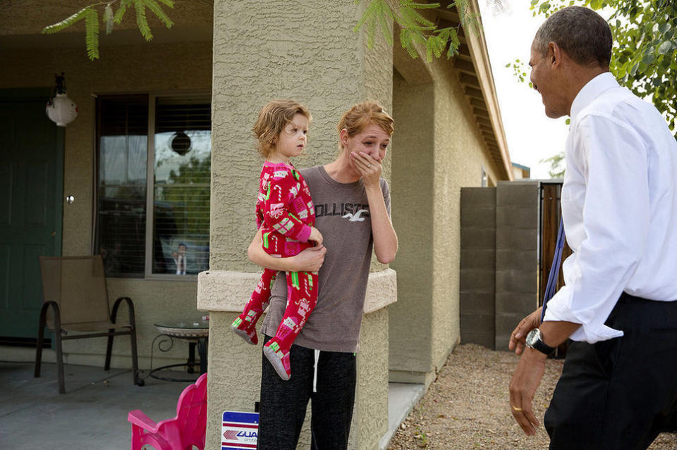 Obama greets neighbors after visiting a model home at the Nueva Villas at Beverly, a single-family housing development owned by local nonprofit organization Chicanos Por La Causa Inc. in Phoenix on Jan. 8, 2015.