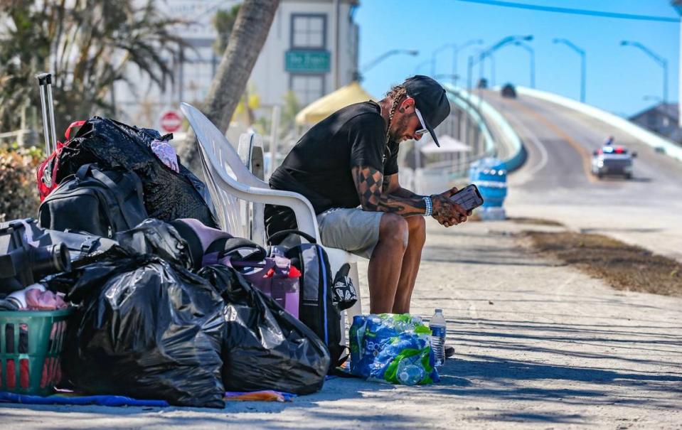 Evacuee Michael Gowen waits for transportation after being evacuated to San Marco Island from Fort Myers Beach on Monday, October 3, 2022 after Hurricane Ian hit the area.