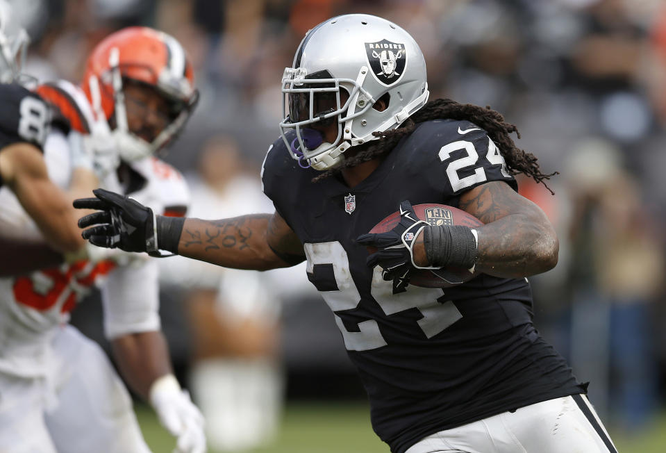 FILE - In this Sept. 30 2018, file photo, Oakland Raiders running back Marshawn Lynch (24) carries against the Cleveland Browns during an NFL football game in Oakland, Calif. Oakland may always be home for Lynch but Seattle was the city that truly made him a star. The Seahawks (2-3) will get an up-close look at Lynch again this week for the first time since he retired following the 2015 season when they travel to London to face the Raiders (1-4). (AP Photo/D. Ross Cameron, File)