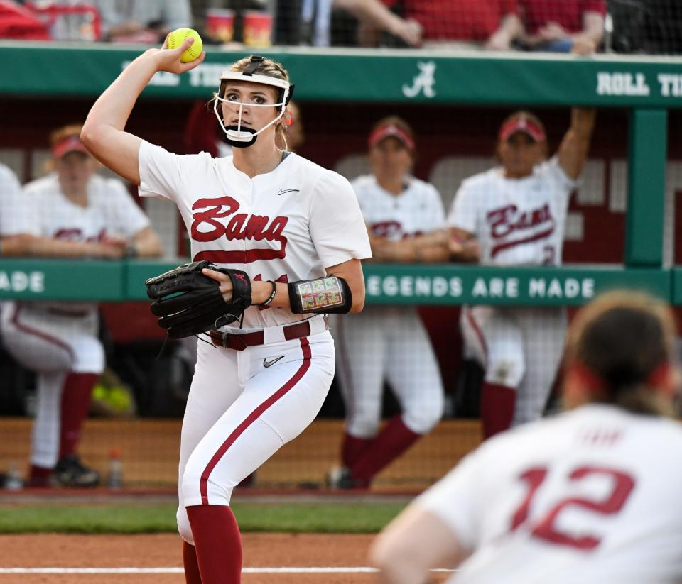 Alabama pitcher Montana Fouts fields a ball hit back to her and throws to first for an out at Rhoads Stadium Friday, March 18, 2022. Alabama won the game 4-2, beginning the weekend series with the Wildcats. 