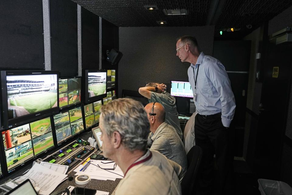 Doug Johnson senior vice president and executive producer for Major League Baseball, watches as producers and directers prepare to broadcast a baseball game between Arizona Diamondbacks and Atlanta Braves Tuesday, July 18, 2023, in Atlanta. (AP Photo/John Bazemore)