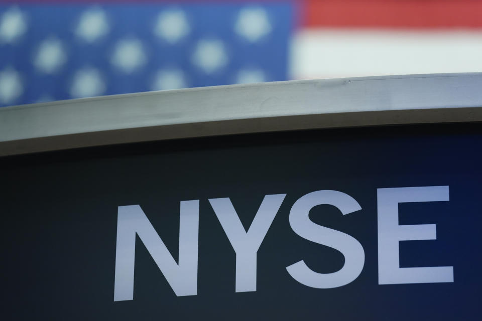 FILE- A sign for New York Stock Exchange is displayed on the floor at the NYSE in New York, Wednesday, July 27, 2022. Stocks were modestly higher early Friday, July 29, 2022, on Wall Street, despite news that closely watched inflation data jumped by the most in four decades last month. (AP Photo/Seth Wenig, File)