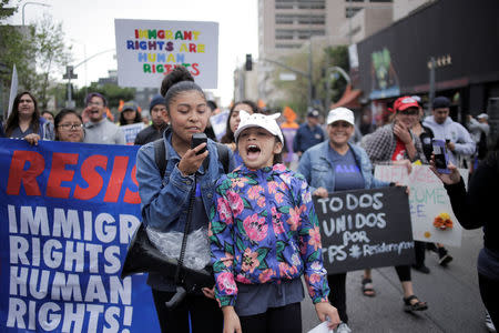 People march in a May Day rally in Los Angeles, California, U.S., May 1, 2018. REUTERS/Jenna Schoenefeld