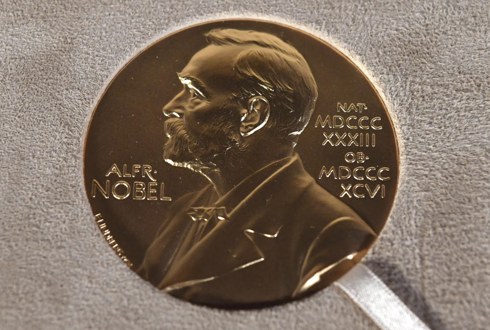 FILE - A Tuesday, Dec. 8, 2020 file photo of a Nobel medal displayed during a ceremony in New York. The Nobel Prize in Literature is due to be awarded on Thursday Oct. 7, 2021. (Angela Weiss/Pool Photo via AP, File)