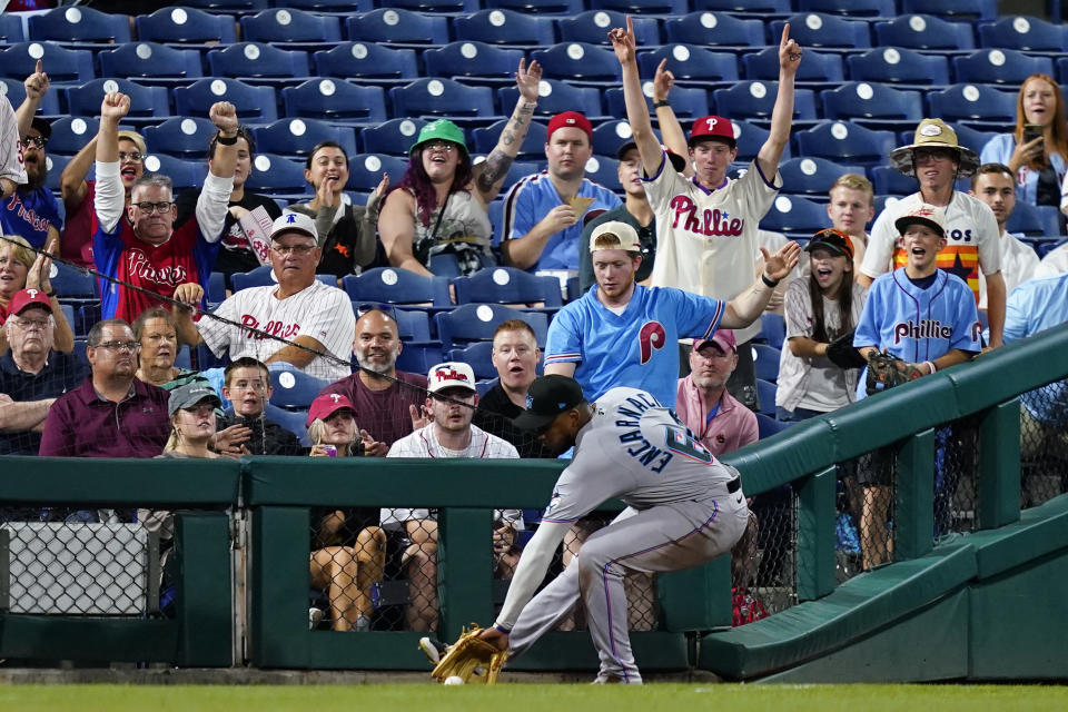 Miami Marlins left fielder Jerar Encarnacion fields a run-scoring double by Philadelphia Phillies' Bryson Stott during the fourth inning of a baseball game, Thursday, Sept. 8, 2022, in Philadelphia. (AP Photo/Matt Slocum)