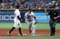 Apr 20, 2019; St. Petersburg, FL, USA; Boston Red Sox first baseman Steve Pearce (25) celebrate as he tags out Tampa Bay Rays left fielder Tommy Pham (29) to end the game and beat the Tampa Bay Rays at Tropicana Field. Mandatory Credit: Kim Klement-USA TODAY Sports