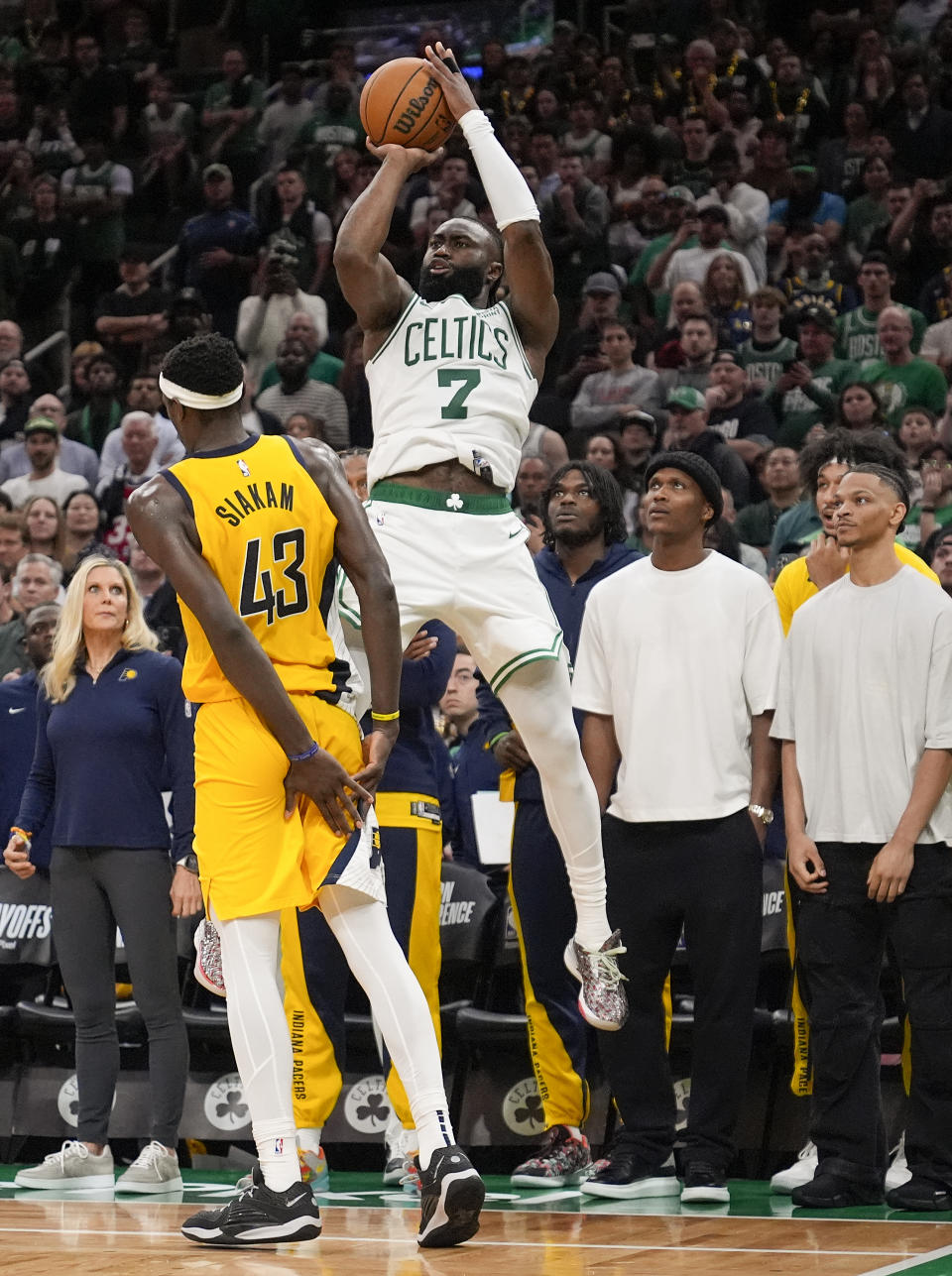 Boston Celtics guard Jaylen Brown (7) puts up a 3-point shot to score and tie the game against the Indiana Pacers with seconds left in Game 1 of the NBA Eastern Conference basketball finals, Tuesday, May 21, 2024, in Boston. (AP Photo/Charles Krupa)