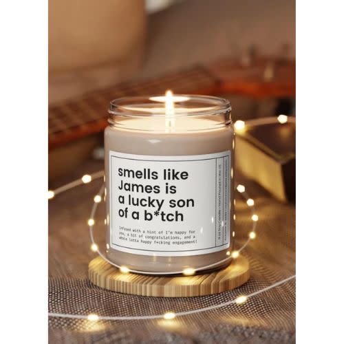 white candle with funny label