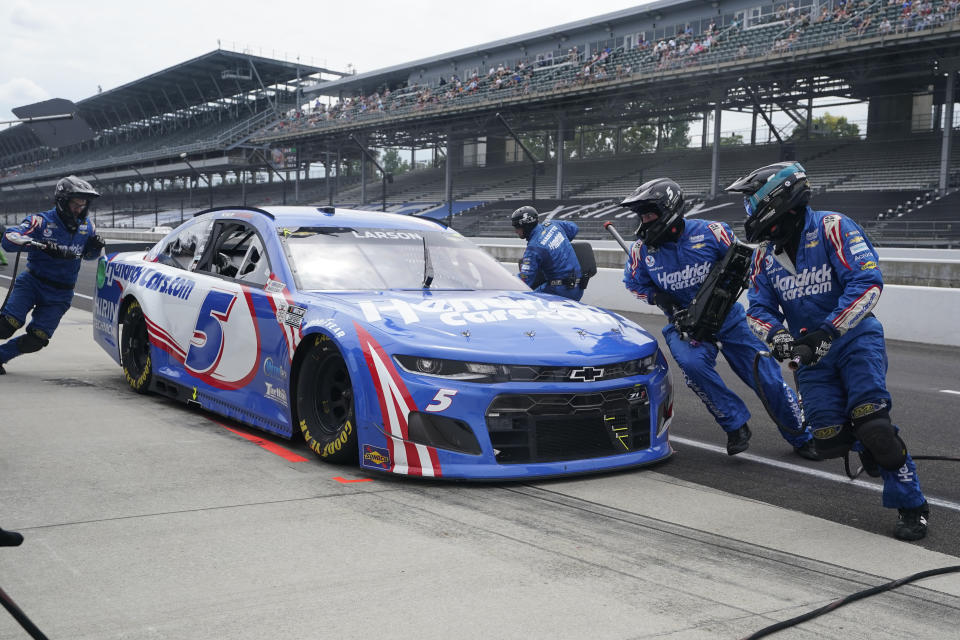 Kyle Larson makes a pit stop during a NASCAR Series auto race at Indianapolis Motor Speedway, Sunday, Aug. 15, 2021, in Indianapolis. (AP Photo/Darron Cummings)