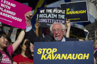 <p>Sen. Bernie Sanders, I-Vt., speaks with protesters in front of the Supreme Court in Washington, Monday, July 9, 2018, after President Donald Trump announced Judge Brett Kavanaugh as his Supreme Court nominee. (Photo: Cliff Owen/AP) </p>