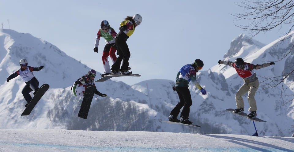 Lindsey Jacobellis, right, of the United States leads during the women's snowboard cross semifinal at the Rosa Khutor Extreme Park, at the 2014 Winter Olympics, Sunday, Feb. 16, 2014, in Krasnaya Polyana, Russia. The other riders are, from left, Britain's Zoe Gillings, Italy's Michela Moioli, Canada's Dominique Maltais, Bulgaria's Alexandra Jekova, and Australia's Belle Brockhoff. (AP Photo/Luca Bruno)