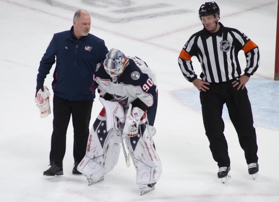 Columbus Blue Jackets goaltender Elvis Merzlikins (90) leaves the ice with two minutes left in the second period with an injury during NHL hockey game action against the Montreal Canadiens in Montreal, Saturday, March 25, 2023. (Peter McCabe/The Canadian Press via AP)