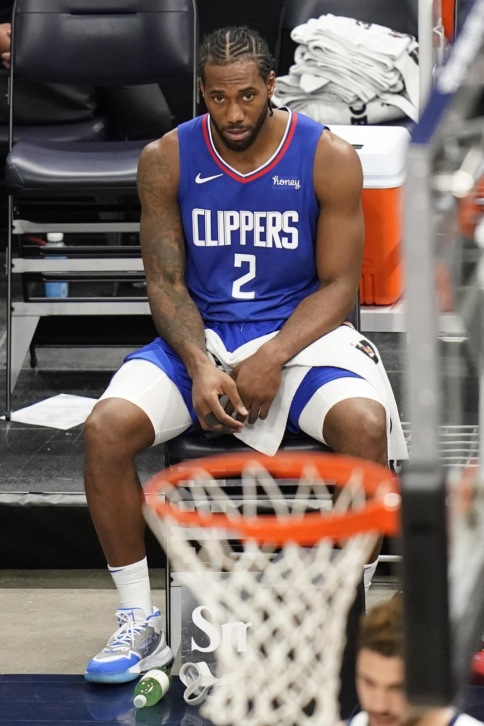 Los Angeles Clippers forward Kawhi Leonard sits on the bench during the first half of the team's NBA basketball game against the Utah Jazz on Friday, Jan. 1, 2021, in Salt Lake City. (AP Photo/Rick Bowmer)