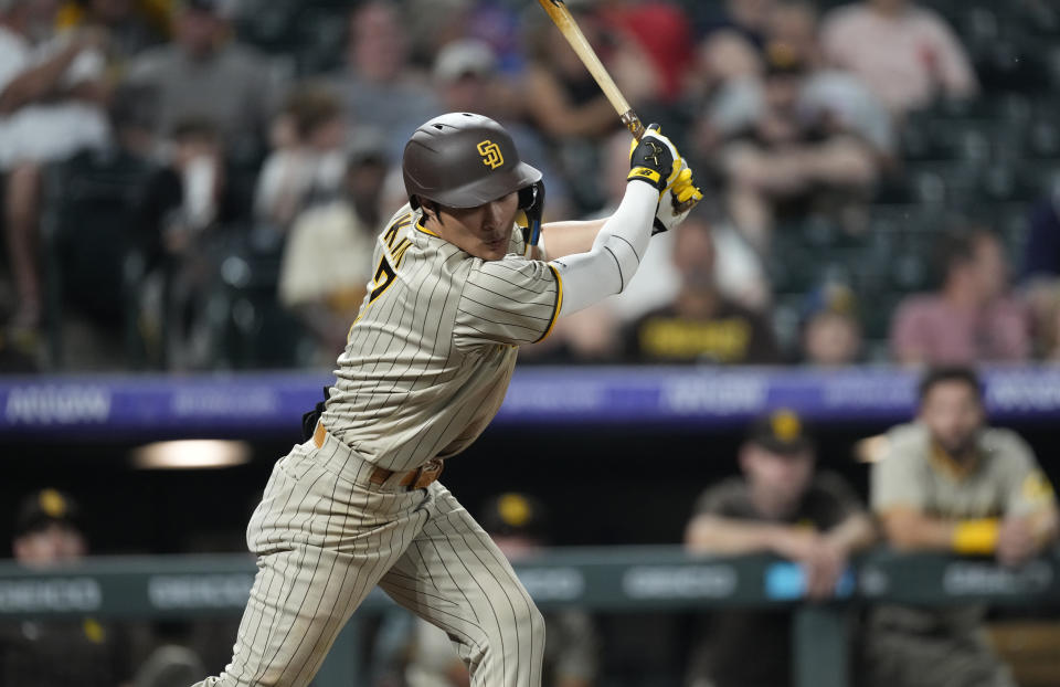 San Diego Padres' Ha-Seong Kim strikes out against Colorado Rockies relief pitcher Jake Bird in the ninth inning of a baseball game Friday, June 17, 2022, in Denver. (AP Photo/David Zalubowski)