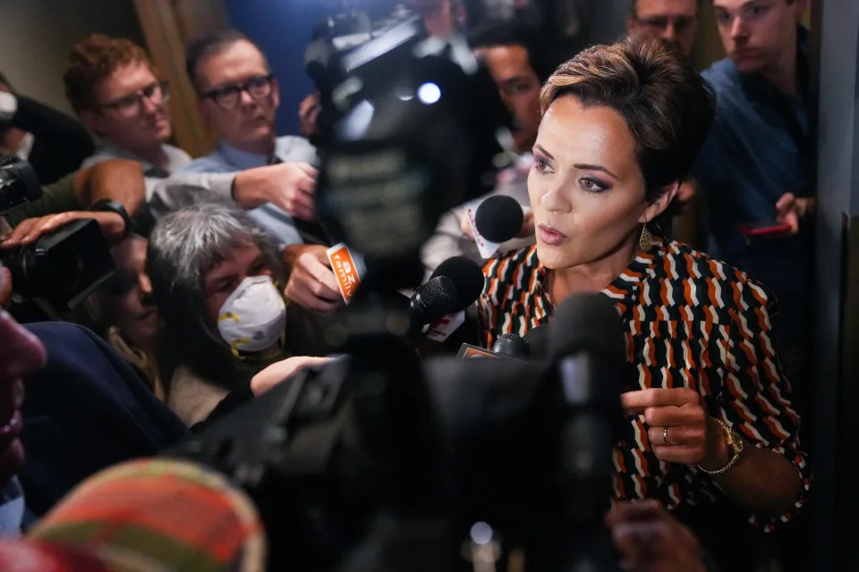 Kari Lake answers questions after a debate with Republican candidates ahead of the Aug. 2 primary election for the Arizona governor's office on Wednesday, June 29, 2022, in Phoenix.