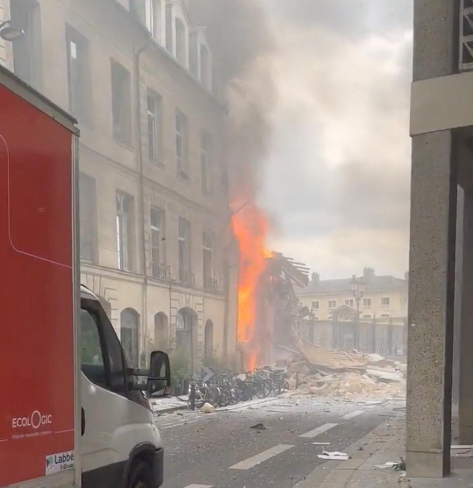 Flames and smoke erupt from a building (Reuters)