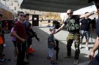 <p>An Israeli instructor speaks to children from overseas holding wooden cut-out rifles as they take part in a two hour “boot camp” experience, at “Caliber 3 Israeli Counter Terror and Security Academy” in the Gush Etzion settlement bloc south of Jerusalem in the occupied West Bank July 13, 2017. (Photo: Nir Elias/Reuters) </p>