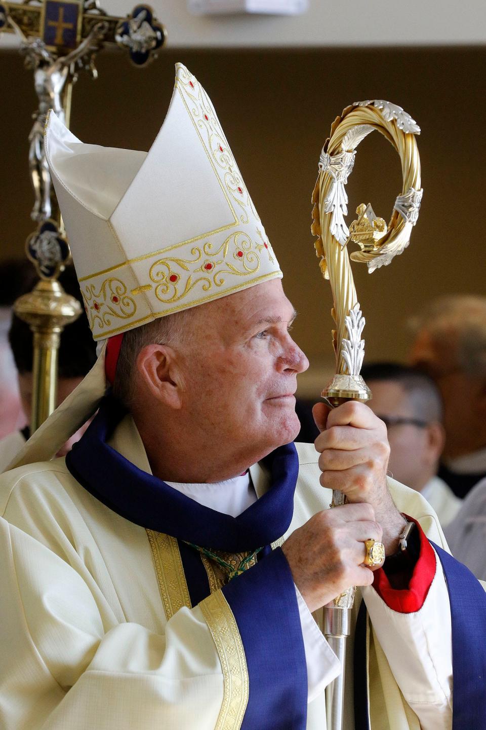 Diocese of Trenton Bishop David M. O’Connell, C.M., watches the procession of color guard members at St. Robert Bellarmine Co-Cathedral in Freehold Thursday, April 13, 2023, during the Blue Mass for law enforcement held there.