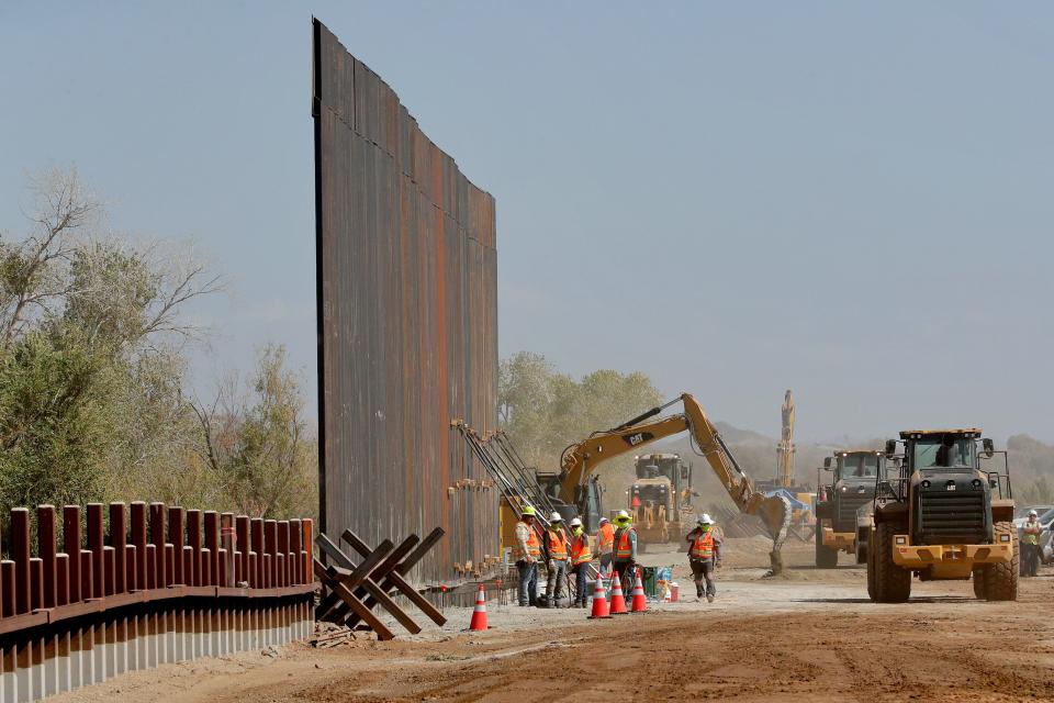 Government contractors erect a section of the border wall on Sept. 10, 2019, in Yuma, Arizona.