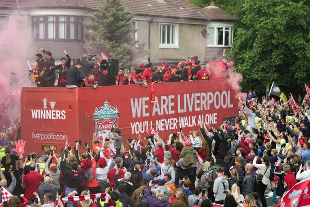 Liverpool celebrate their FA Cup and Carabao Cup wins with fans on a parade through the city