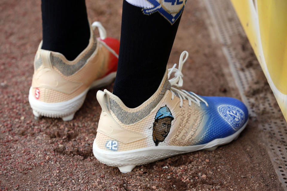 Texas Rangers' Delino DeShields wears shoes with Jackie Robinson's image prior to playing the Los Angels Angels in a baseball game Monday, April 15, 2019, in Arlington, Texas. Major League Baseball teams commemorated Jackie Robinson Day on Monday. (AP Photo/Michael Ainsworth)