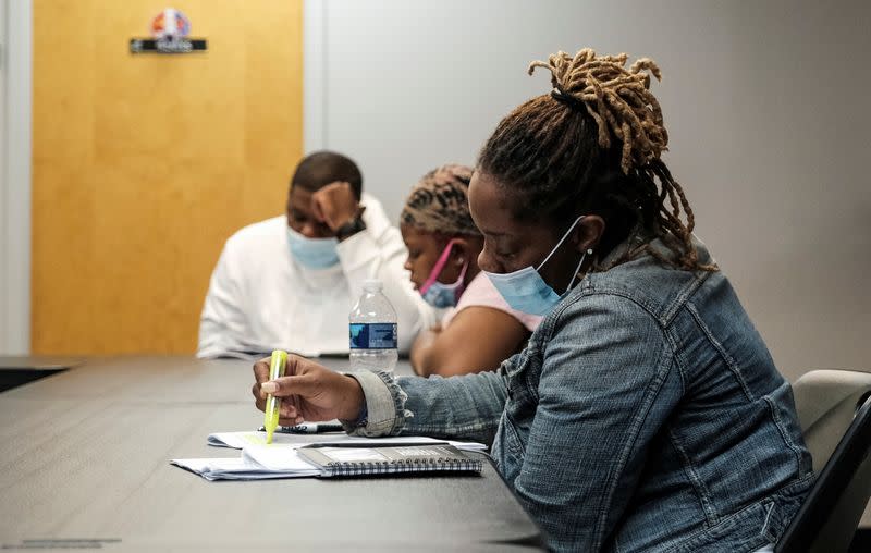 Special police recruits study police use of force guidelines during training in Maryland