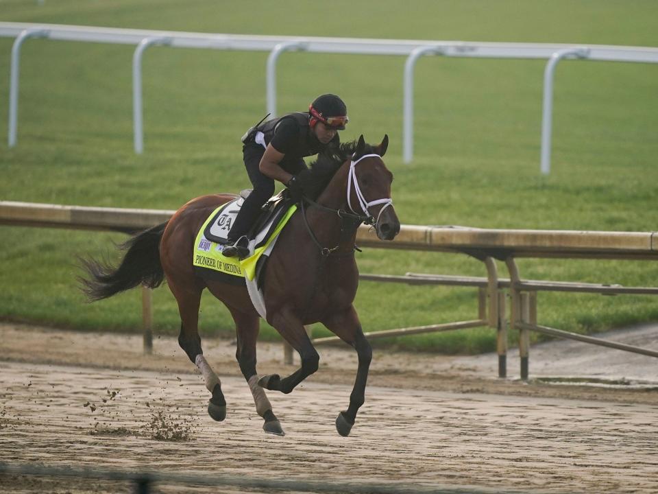 Kentucky Derby entrant Pioneer of Medina works out at Churchill Downs.